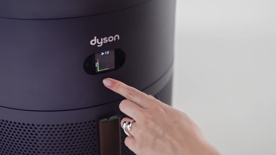 A finger pressing the button under the HushJet Big+Quiet display