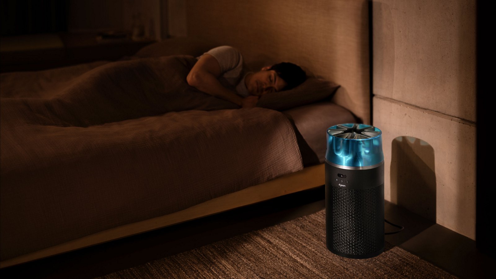 The HushJet Purifier Compact running on a bedroom floor at night